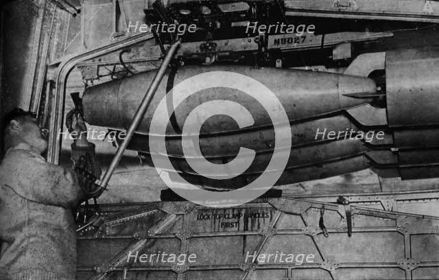 Heavy bombs in the racks of a RAF Short Sunderland flying boat, c1940 (1943). Artist: Unknown.