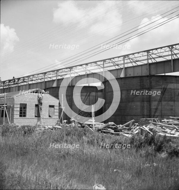 Large turpentine still and processing plant near Valdosta, Georgia, 1937. Creator: Dorothea Lange.