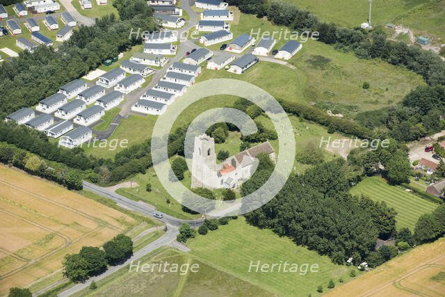 Static caravans and the Church of St Bartholomew, Corton, Suffolk, 2019. Creator: Historic England.