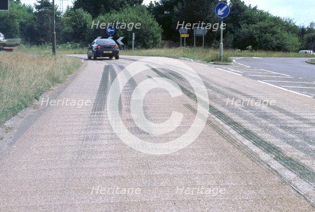 Tyre skidmarks on road surface. Artist: Unknown.