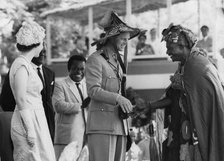 Prince Philip receives a sunhat from Chief Good Gerie, Ghana, 1961. Artist: Unknown