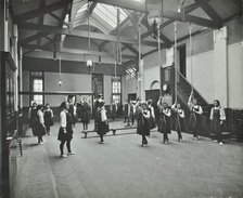 Girls in the gymnasium, Fulham County Secondary School, London, 1908. Artist: Unknown.