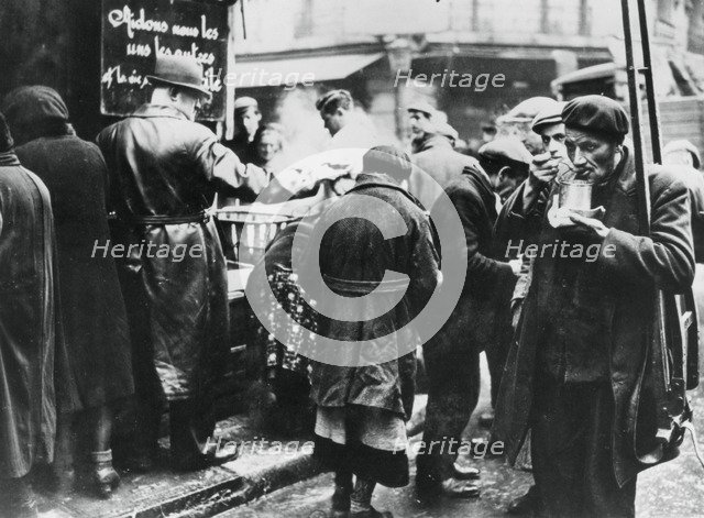 Soup kitchen for the needy, les Halles, German-occupied Paris, February 1941. Artist: Unknown