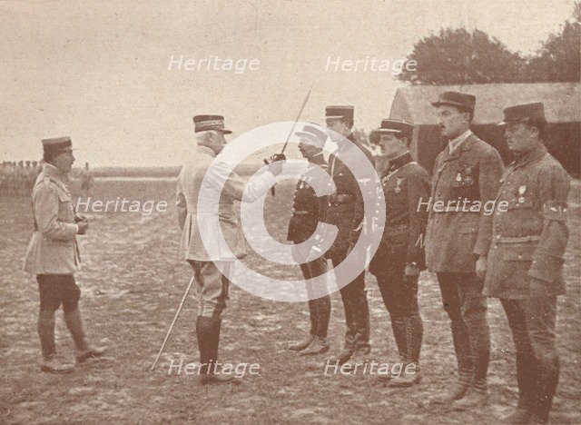 A French General conferring decorations on aviators, c1918 (1919). Artist: Unknown.