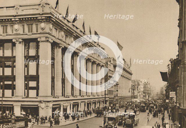 'Selfridge's and the last of the old Oxford Street shops that the building engulfed', c1935. Creator: Unknown.