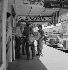 Main street, in front of Oregon Employment Center office, Independence, Polk County, Oregon, 1939. Creator: Dorothea Lange.