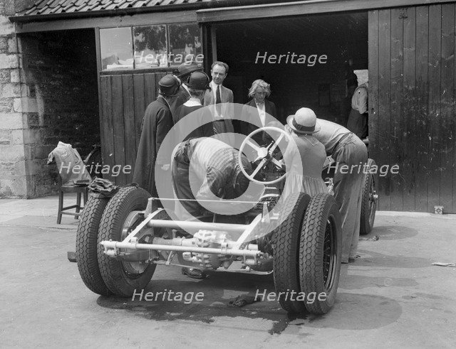 Working on Raymond Mays' Vauxhall-Villiers, c1930s. Artist: Bill Brunell.