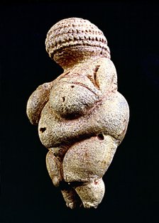 Venus of Willendorf', 110 mm.: woman statue made in limestone and painted with ochre. It is rhomb…