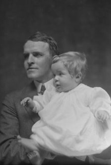 Mitchell, W.C., Mr., and baby, portrait photograph, 1914 May 22. Creator: Arnold Genthe.