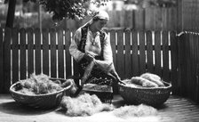 Woman with baskets of wool, Bistrita Valley, Moldavia, north-east Romania, c1920-c1945. Artist: Adolph Chevalier