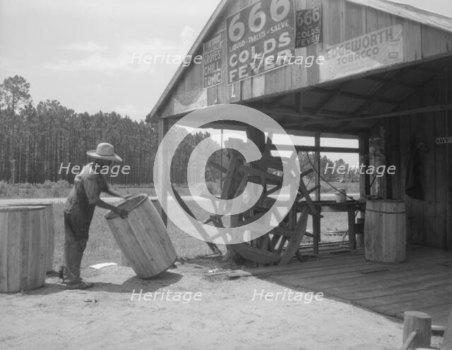 Turpentine still near Valdosta, Georgia, 1937. Creator: Dorothea Lange.