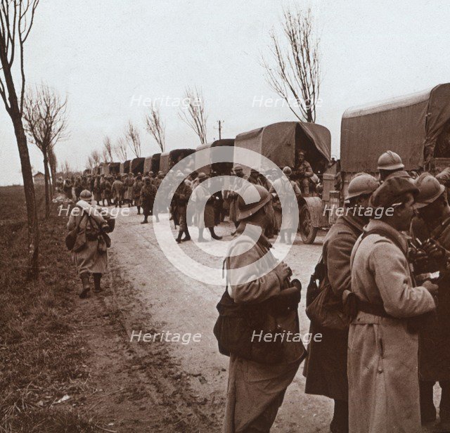 Soldiers and column of trucks on the Voie Sacrée, Verdun, northern France, c1914-c1918. Artist: Unknown.