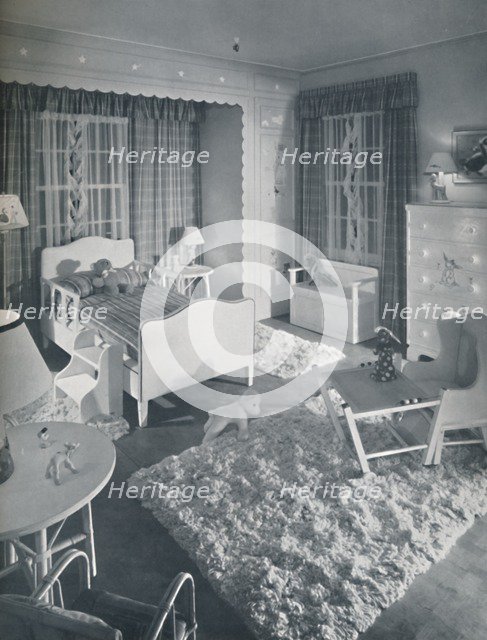 'Nursery by W. & J. Sloane, with cream-coloured furniture and shaggy white rugs on a blue painted fl Artist: Unknown.