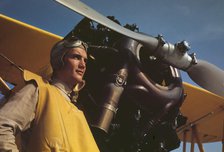 Marine lieutenant by the power plane which tows...at Page Field, Parris, Island, S.C., 1942. Creator: Alfred T Palmer.