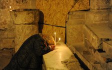 Woman praying, Basilica of the Holy Sepulchre, Jerusalem, Israel, 2014.  Creator: LTL.