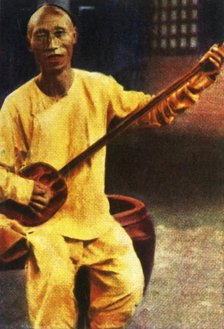 Teahouse musician, China, c1928. Creator: Unknown.