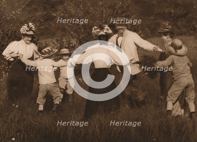 'Family playing games in a field', 1937. Artist: Unknown.