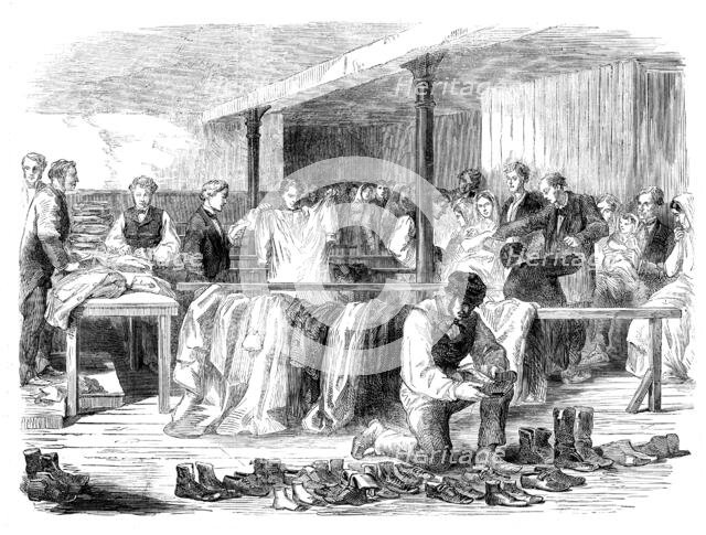 The Cotton Famine: the Manchester and Salford Provident Society distributing clothing, 1862. Creator: Unknown.