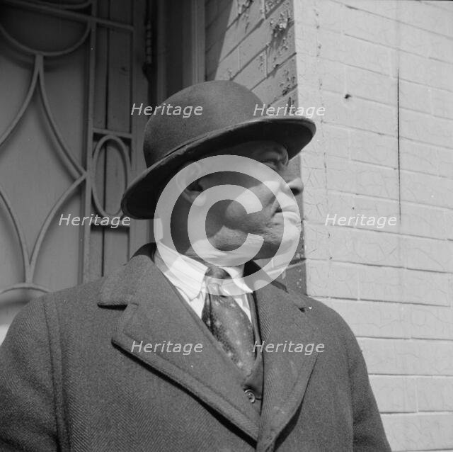 A follower of the late Marcus Garvey who started the "Back to Africa" movement, New York, 1943. Creator: Gordon Parks.