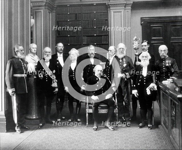 Fellows of the Royal Society: Sir John Evans, bust of Sir Isaac Newton, Lord Kelvin, RB Clifton... Creator: Mayall.