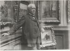 Portrait of Paul Durand-Ruel (1831-1922) in his gallery, c. 1910.