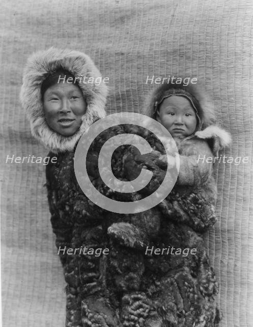 Woman and child, Nunivak, c1929. Creator: Edward Sheriff Curtis.