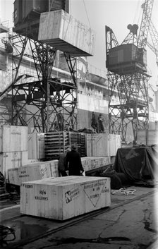 Cased car parts bound for Australia being loaded, King George V Dock, London, c1945-c1965. Artist: SW Rawlings