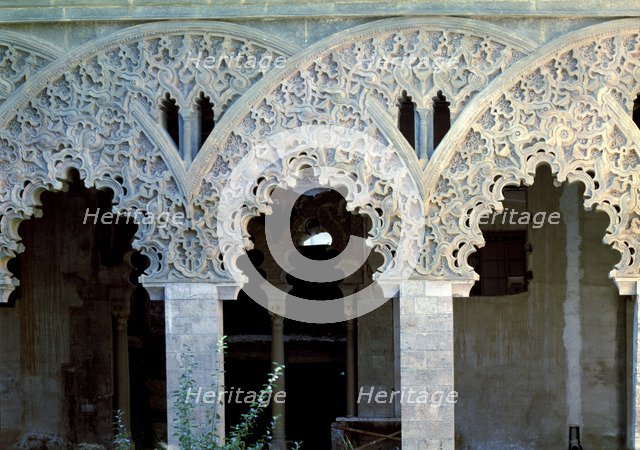 Details of the decoration of the columns' arches in a room of the Aljafería Palace in Zaragoza.