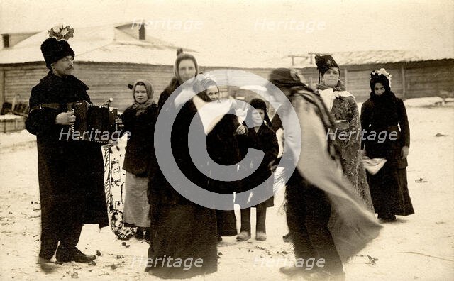 Mummers on the streets of the Znamensky Glass Factory on Christmastide, 1913-1914. Creator: S. Ia. Mamontov.