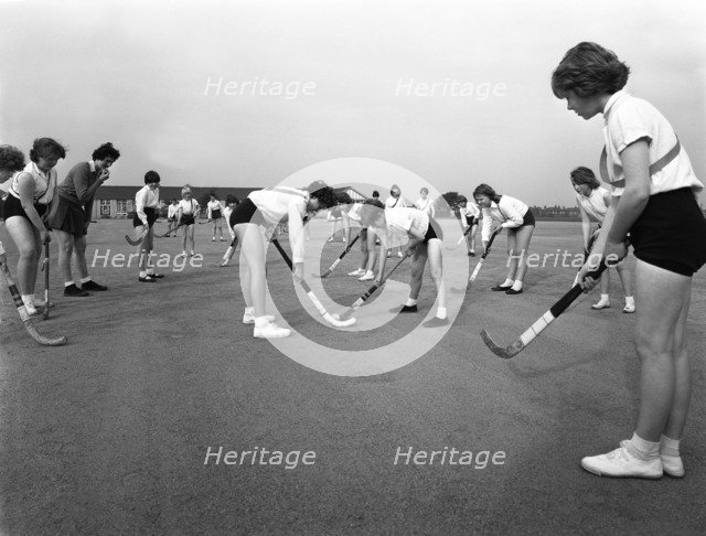 Girls hockey match, Airedale school, Castleford, West Yorkshire, 1962. Artist: Michael Walters