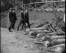 Nazi Officer Hermann Goering in Hunting Dress Showing His Colleagues a Line of Deer He Has..., 1931. Creator: British Pathe Ltd.