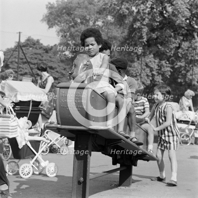 Children on a rocking horse, Clissold Park, Stoke Newington, London, 1962-1964. Creator: John Gay.
