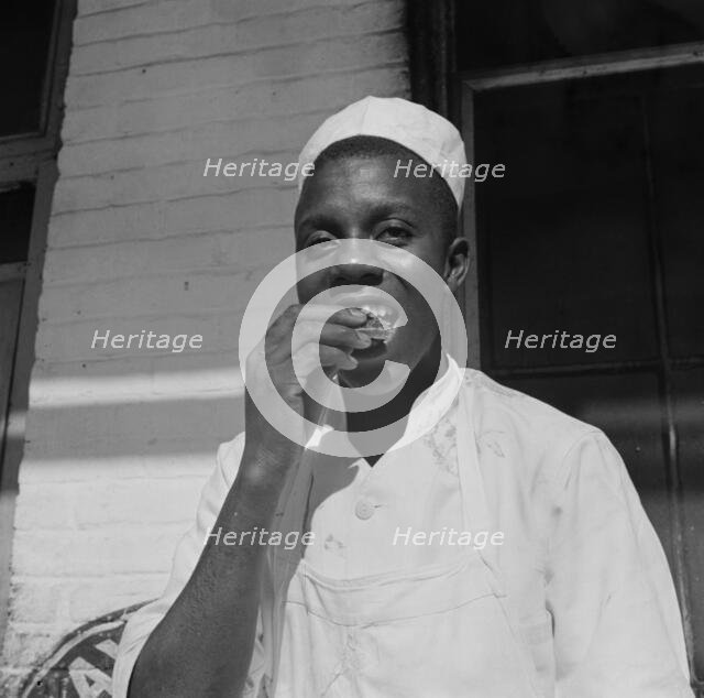 A dishwasher who works in a waterfront restaurant, Washington, D.C., 1942. Creator: Gordon Parks.