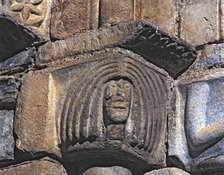  'Female Head', capital of the façade of the church of San Luis de Alos d'Aneu.