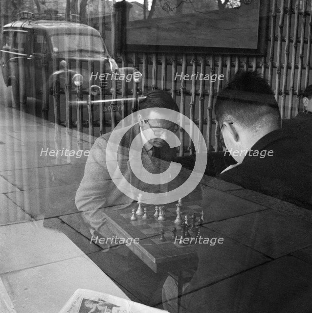 Men playing chess in a cafe, Hampstead, London, 1962-1964. Artist: John Gay