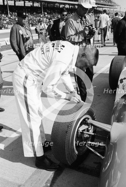 Technician checking tyre wear, Indianapolis, Indiana, USA, 1965. Artist: Unknown