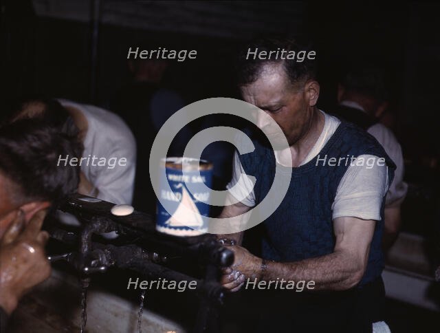 Joseph Klesken washing up after a day's work...Proviso yards of the C & NW RR, Chicago, Ill., 1943. Creator: Jack Delano.