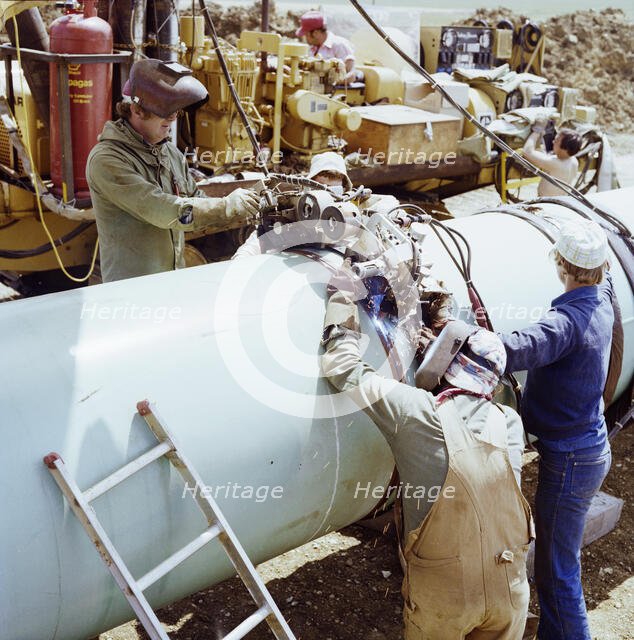 A team of welders working on the Martin pipeline, Hertfordshire, 07/07/1981. Creator: John Laing plc.