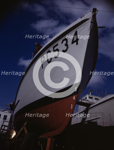 Another harrier of the U-boats nears completion..., Marine Construction Co., Stamford, Conn. , 1942. Creator: Howard Liberman.