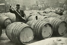 "There Are a Quarter of a Million Gallons of Port in the Port Vaults" - Wine Gauging Ground', 1937. Creator: Fox.
