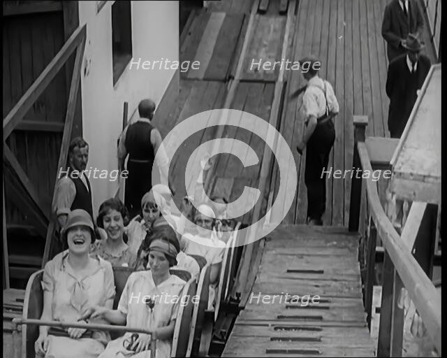 A Large Group of Female Civilians Enjoying  a Roller Coaster Ride, 1926. Creator: British Pathe Ltd.