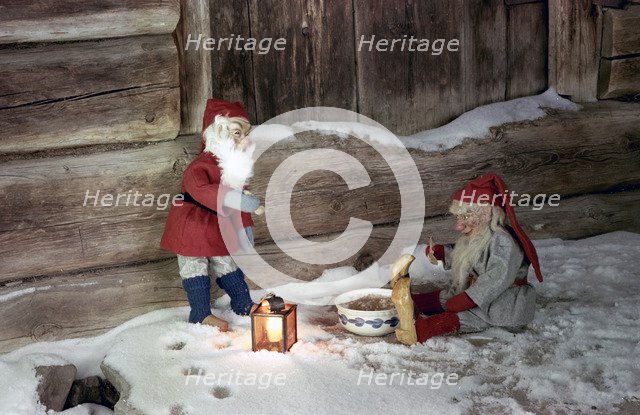 Christmas brownies getting their christmas porridge, 1960s. Artist: Göran Algård