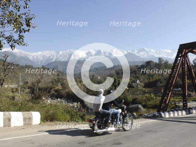 Motorcycle on road near Dhauladar Mountains Himachal Pradesh. Creator: Unknown.