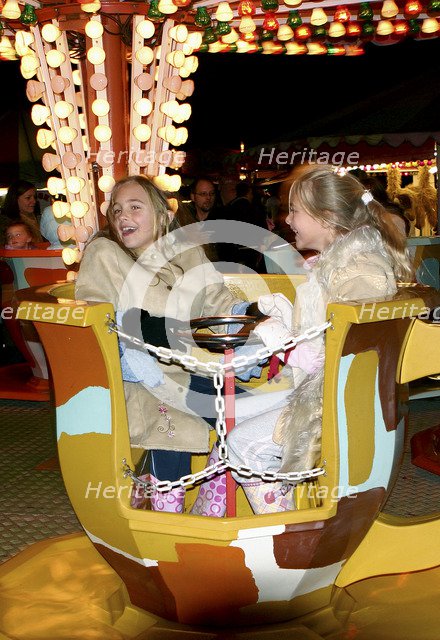 Children on a fairground ride, 2005 