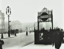 Trafalgar Square with Underground entrance and Admiralty Arch behind, London, 1913. Artist: Unknown.