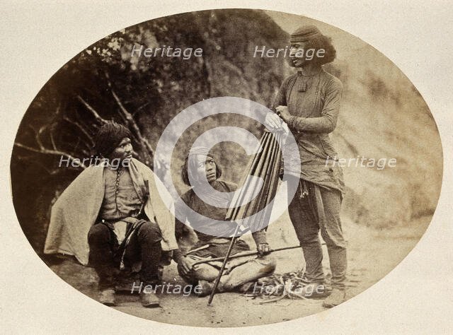 Nepal: military men: two seated, one standing, c1860. Creator: Clarence Comyn Taylor.
