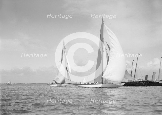 The 19-metre class 'Mariquita' (C1) & 'Corona' (C3) running with spinnakers up, 1911. Creator: Kirk & Sons of Cowes.