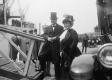 Mrs. Josephus Daniels,with Sec. Daniels Boarding Mayflower. Allied Commission, 1917. Creator: Harris & Ewing.