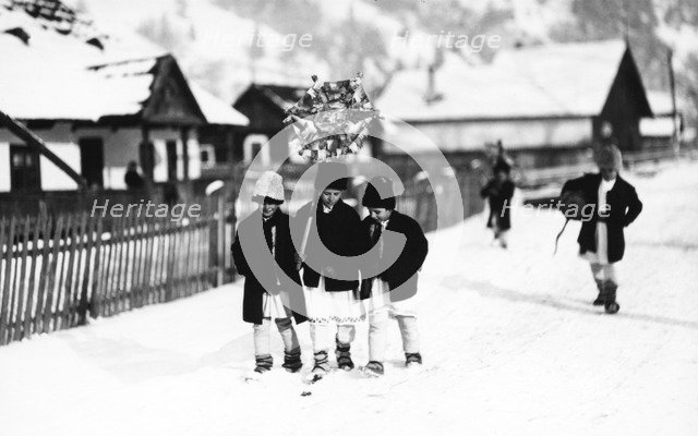 Children walking in the snow, Bistrita Valley, Moldavia, north-east Romania, c1920-c1945. Artist: Adolph Chevalier