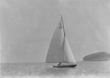 The 6 Metre class 'Jean' (K16) sailing in light winds, 1921. Creator: Kirk & Sons of Cowes.